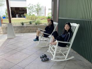 Heemin and Yoon Young on the porch